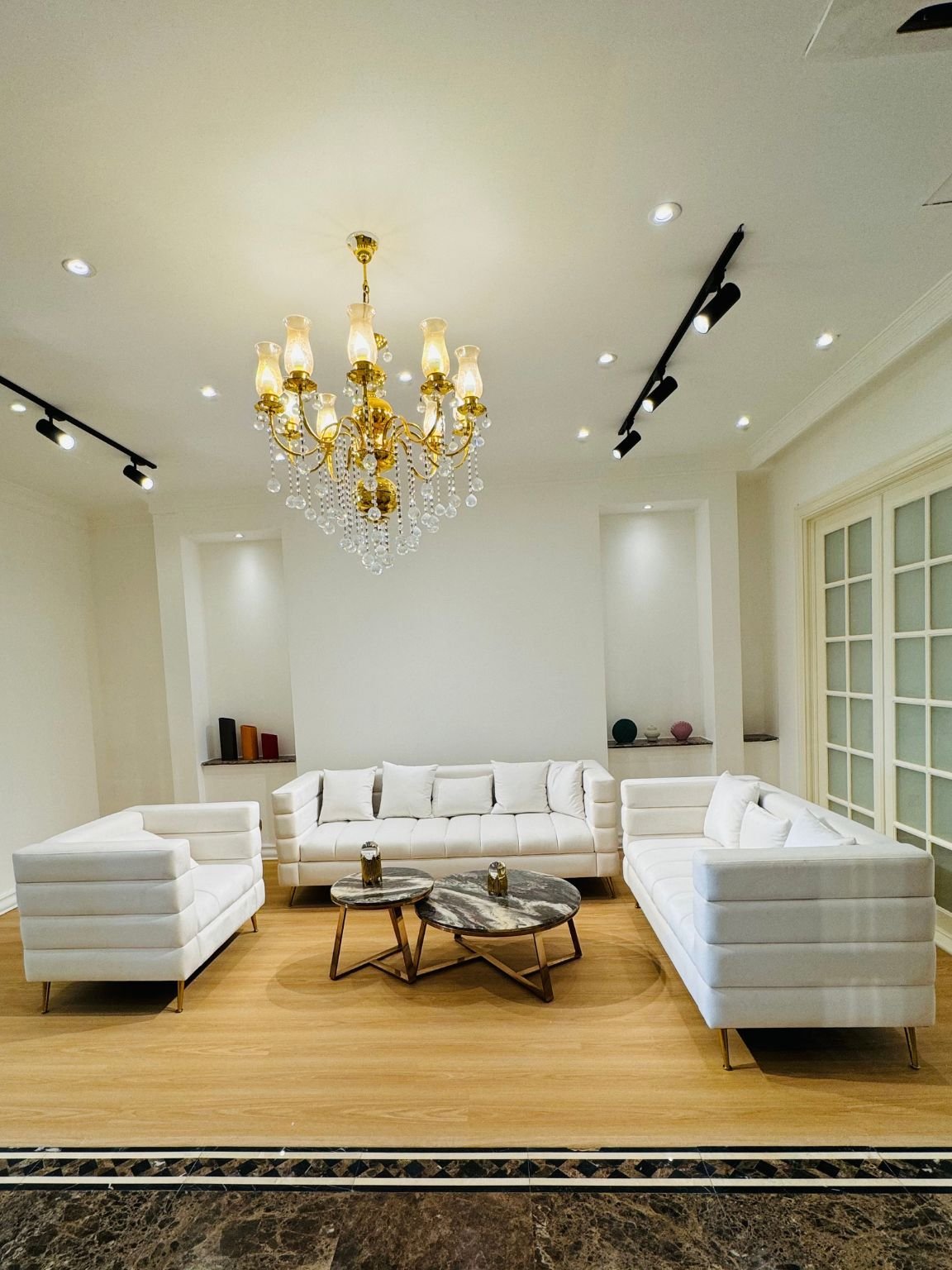 Customize Sofa in Dubai featuring elegant white custom sofas in a modern luxury living room interior.